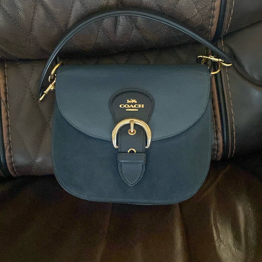 Beautiful and trendy Coach shoulder bag with gold accents!